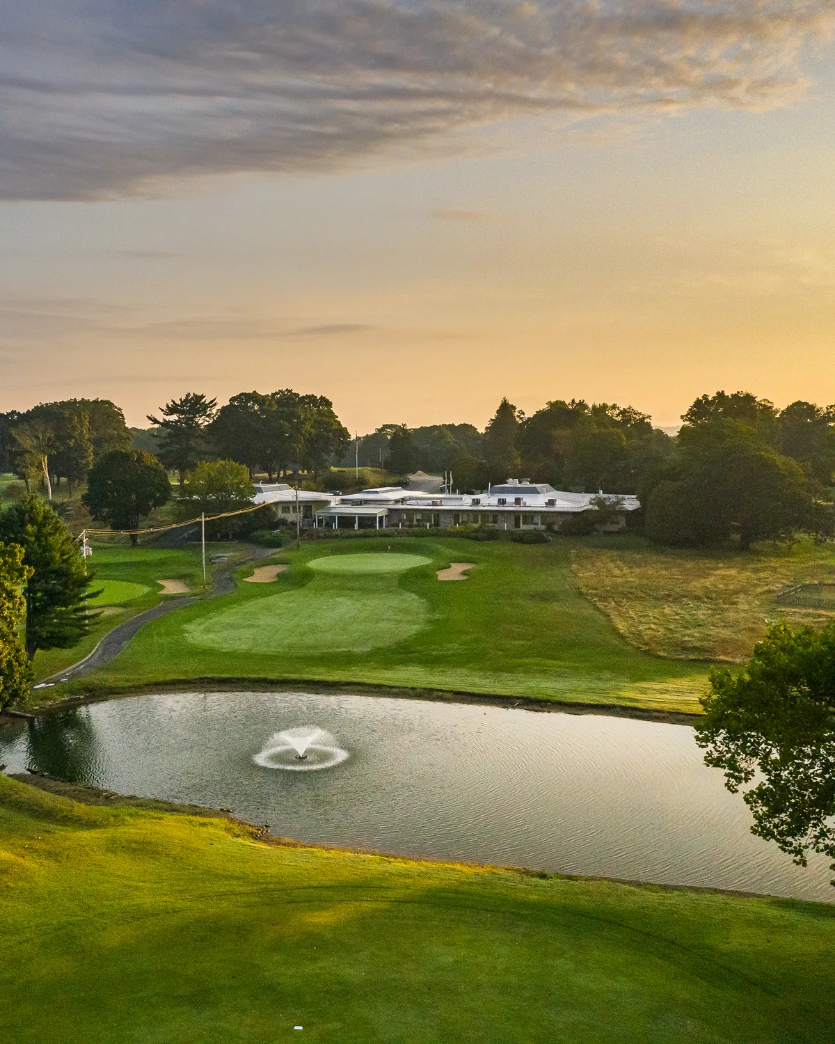 The course at Potowomut — fairway framed by treeline